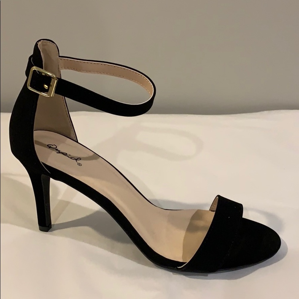 Black strapped heels.
